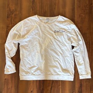 Woman’s white crewneck sweatshirt